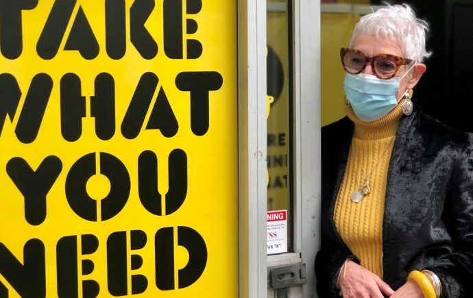 Ronni standing outside OzHarvest Market Waterloo - landscape photo wearing a mask